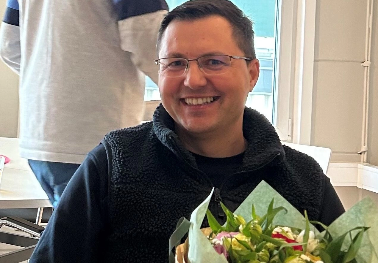 Igor receiving flowers and gifts for 10 years of dedicated service for Griptel